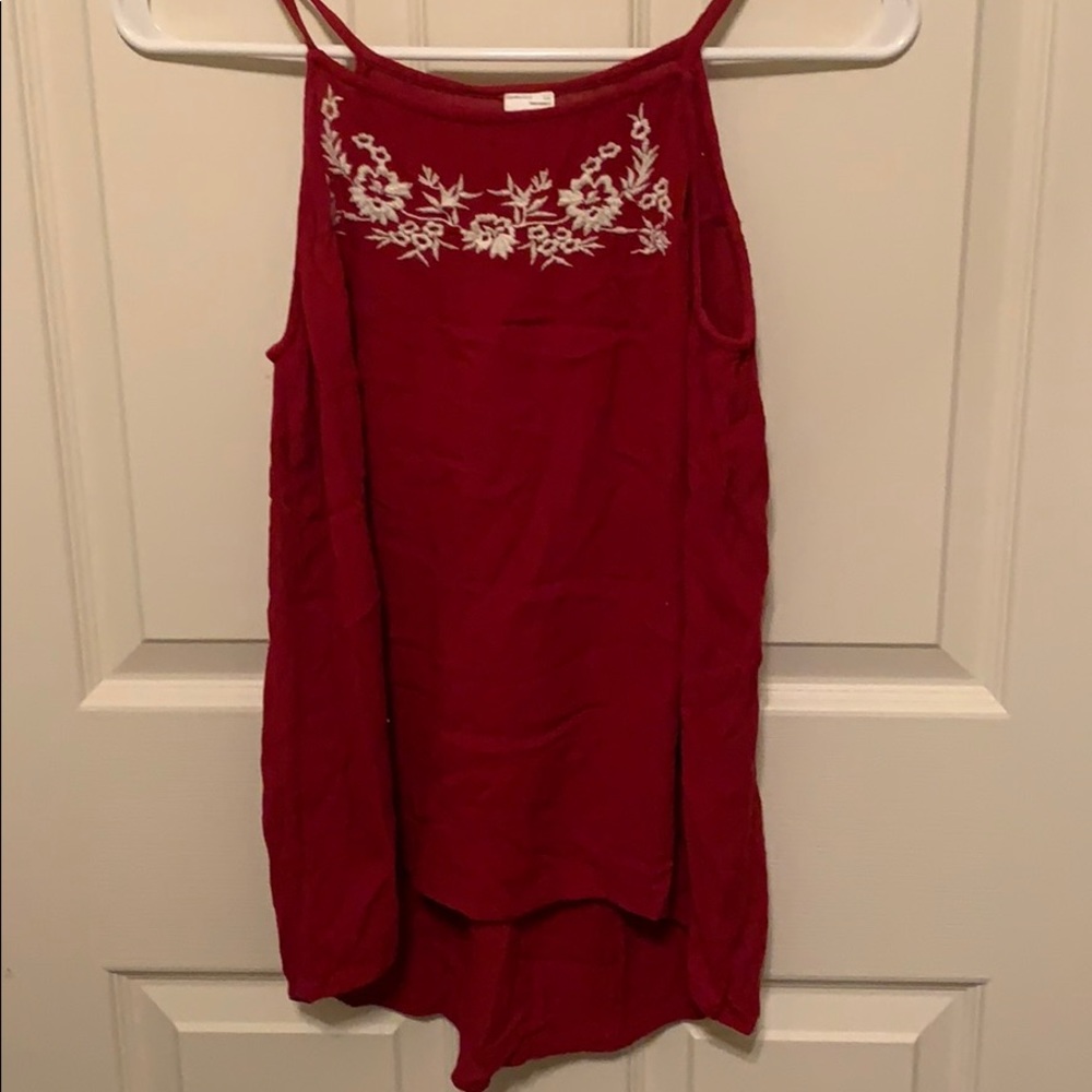 Red tank top with floral embroidery at neckline